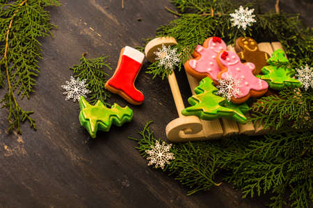 Christmas concept with gingerbread man cookie on dark wooden backgroundの写真素材