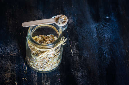 Healthy food concept with oats meal on dark rustic background with copyspaceの写真素材
