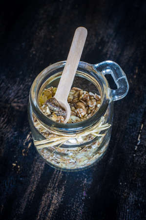 Healthy food concept with oats meal on dark rustic background with copyspaceの写真素材
