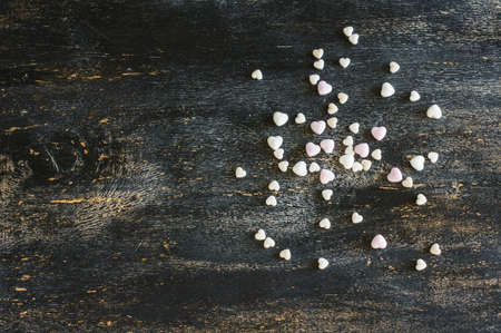 Festive frame with hearts on dark background with copyspaceの写真素材