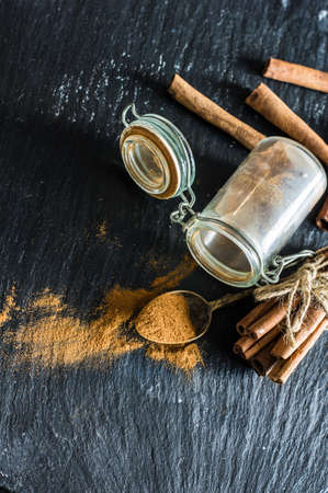 Spices like a cinnamon and anise star for desserts on dark woodn rustic backgroundの写真素材