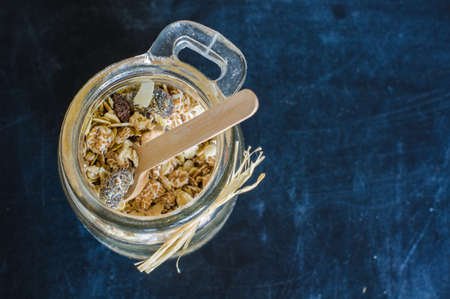 Healthy food concept with oats meal on dark rustic background with copyspaceの写真素材