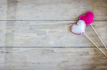 Festive frame with hearts on dark background with copyspaceの写真素材