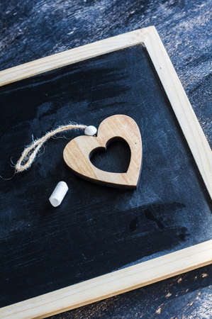 Festive frame with hearts on dark background with copyspaceの写真素材