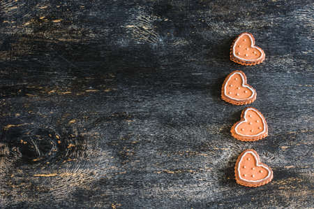 Festive frame with hearts on dark background with copyspaceの写真素材