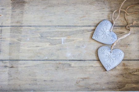 Festive frame with hearts on dark background with copyspaceの写真素材