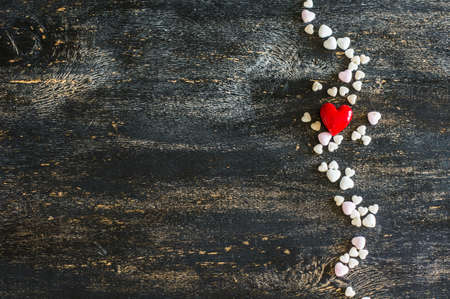 Festive frame with hearts on dark background with copyspaceの写真素材