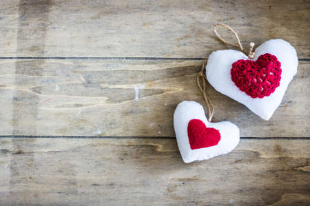 Festive frame with hearts on dark background with copyspaceの写真素材