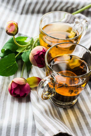 Cup of tea with lemon on dark rustic wooden table with copyspaceの写真素材