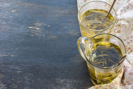 Green tea set on dark wooden rustic tableの写真素材