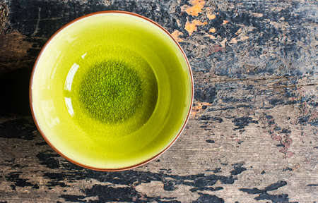 Empty rustic bowl and vintage silverware on old wooden tableの写真素材
