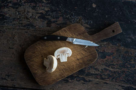 Organic food concept with fresh mushrooms on dark wooden tableの写真素材