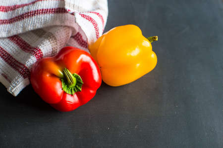 Healthy food concept with  fresh organic vegetables as a ingredients for salads on dark wooden tableの写真素材