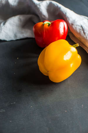 Healthy food concept with  fresh organic vegetables as a ingredients for salads on dark wooden tableの写真素材