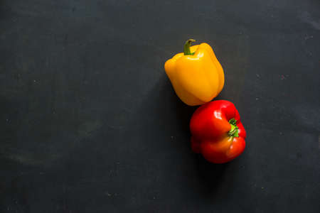 Healthy food concept with  fresh organic vegetables as a ingredients for salads on dark wooden table