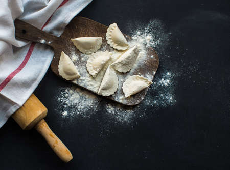 Vareniki (dumplings, pierogi) with cheese before boiling - traditional Ukrainian foodの写真素材
