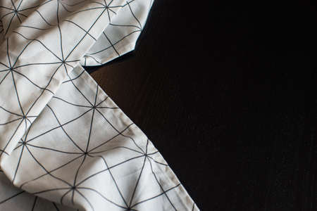 Kitchen towel on dark wooden table with copyspaceの写真素材