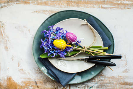 Rustic table setting with blue hyacinth  on wooden table