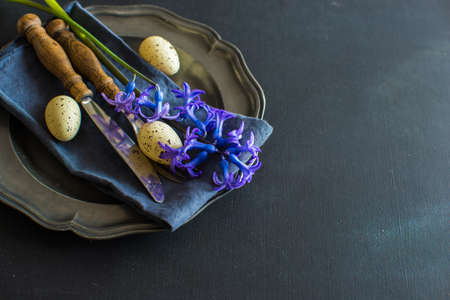 Rustic table setting with blue hyacinth  on wooden table