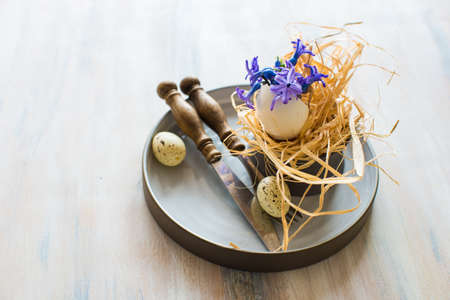 Rustic table setting with blue hyacinth  on wooden table