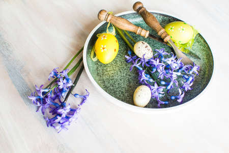 Rustic table setting with blue hyacinth  on wooden table