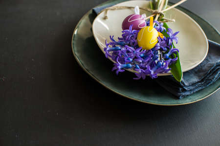 Rustic table setting with blue hyacinth  on wooden table