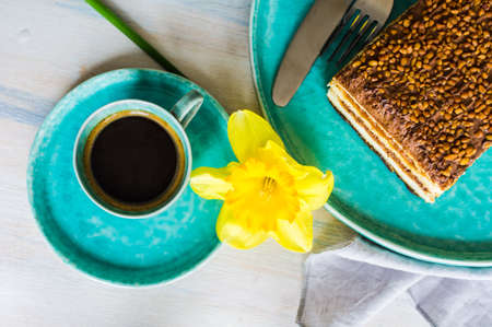 Vanilla and chocolate biscuit cake on rustic wooden tableの写真素材