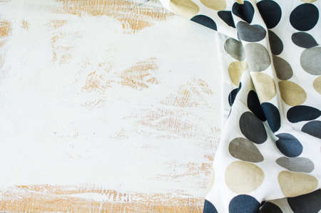 Kitchen towel or napkin over the rustic wooden table. View from above with copy spaceの写真素材