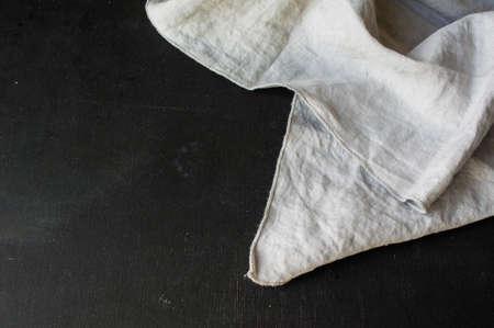 Kitchen towel or napkin over the rustic wooden table. View from above with copy space
