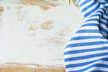 Kitchen towel or napkin over the rustic wooden table. View from above with copy spaceの写真素材