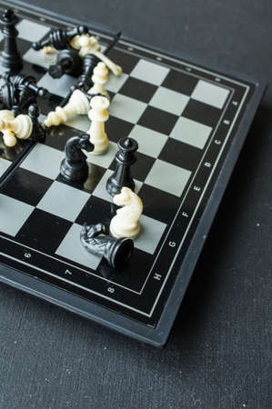 Chess board game on dark wooden tableの写真素材