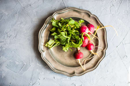 Fresh sliced organic radish vegetable on a cutting boardの写真素材