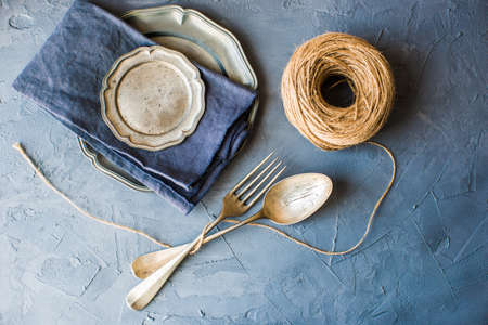 Table setting with vintage spoons on grey concrete backgroundの写真素材