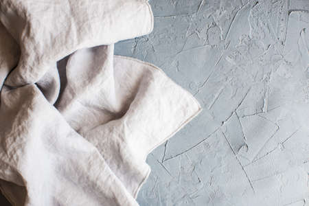 Kitchen towel or napkin over the rustic concrete table. View from above with copy spaceの写真素材