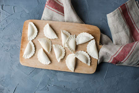 Vareniki (dumplings, pierogi) with cheese before boiling - traditional Ukrainian foodの写真素材