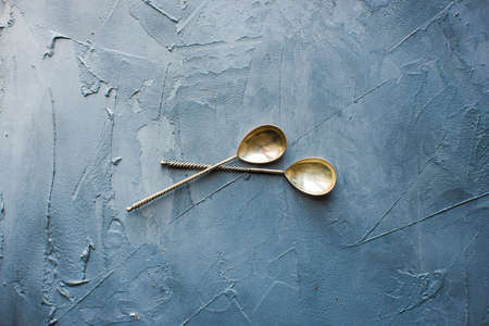 Table setting with vintage spoons on grey concrete backgroundの写真素材