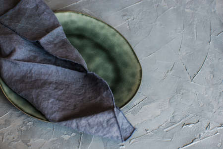 Vintage silverware on rustic concrete covered grey tableの写真素材