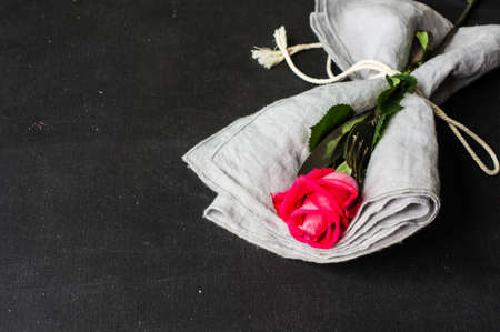 Table setting with red rose for Valentines day dinnerの写真素材