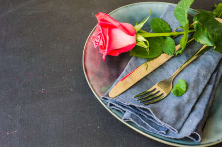 Table setting with red rose for Valentines day dinnerの写真素材