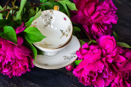 Summer table setting with purple peonies with copyspace
