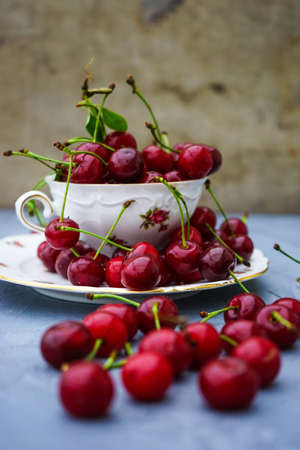 Fresh cherry berries on rustic concrete backgroundの写真素材