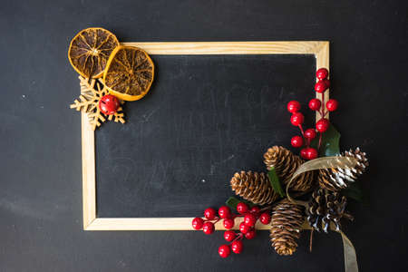 Chalkboard with Christmas decoration as a festive concept with copyspaceの写真素材