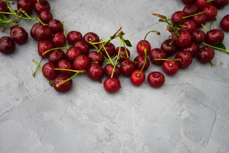 Fresh cherry berries on rustic concrete backgroundの写真素材