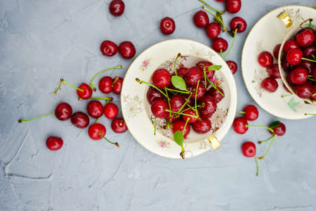 Fresh cherry berries on rustic concrete backgroundの写真素材