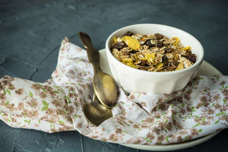 Healthy food concept with oatmeal and fruits on concrete background