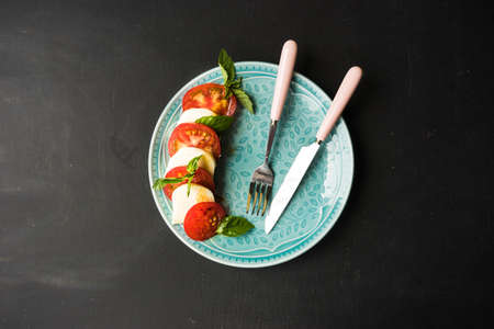 Traditional Mediterranean cuisine, Italian salad Caprese with tomatoes and cheese mozzarellaの写真素材