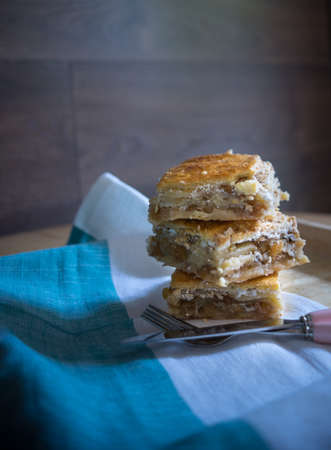 Traditional georgian sweet dessert - kada on the table decorated with summer flowersの写真素材