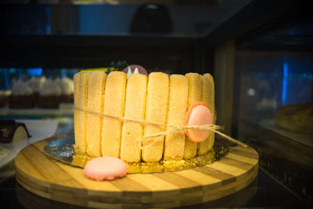 Cakes in a bakery are ready to be bought by someone