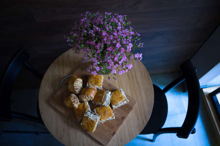 Traditional georgian sweet dessert - kada on the table decorated with summer flowersの写真素材