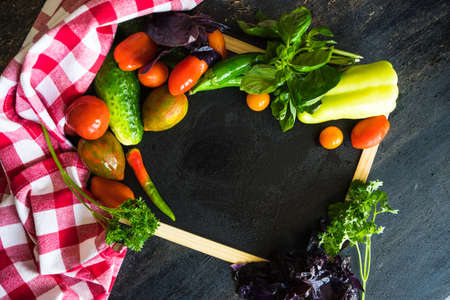 Fresh vegetables on the old wooden tableの写真素材